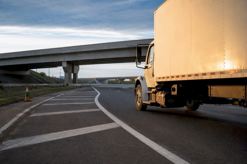 Moving truck traveling through interstate interchange